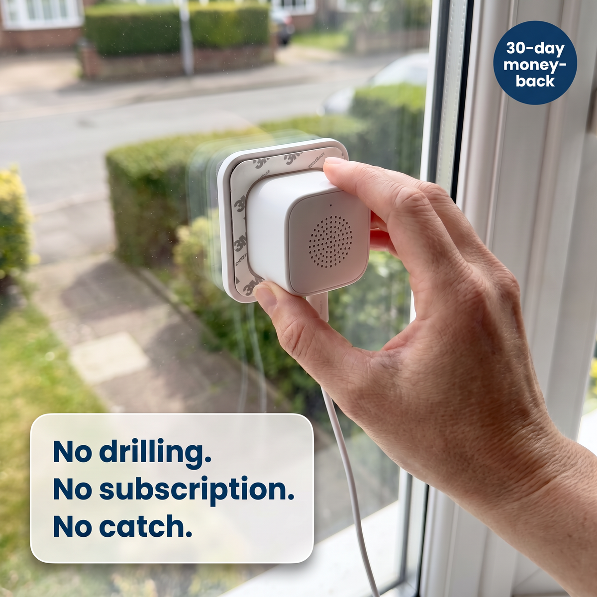 Hand sticking the LookOut camera to the inside of a window: no drilling, no subscription, 30-day money-back