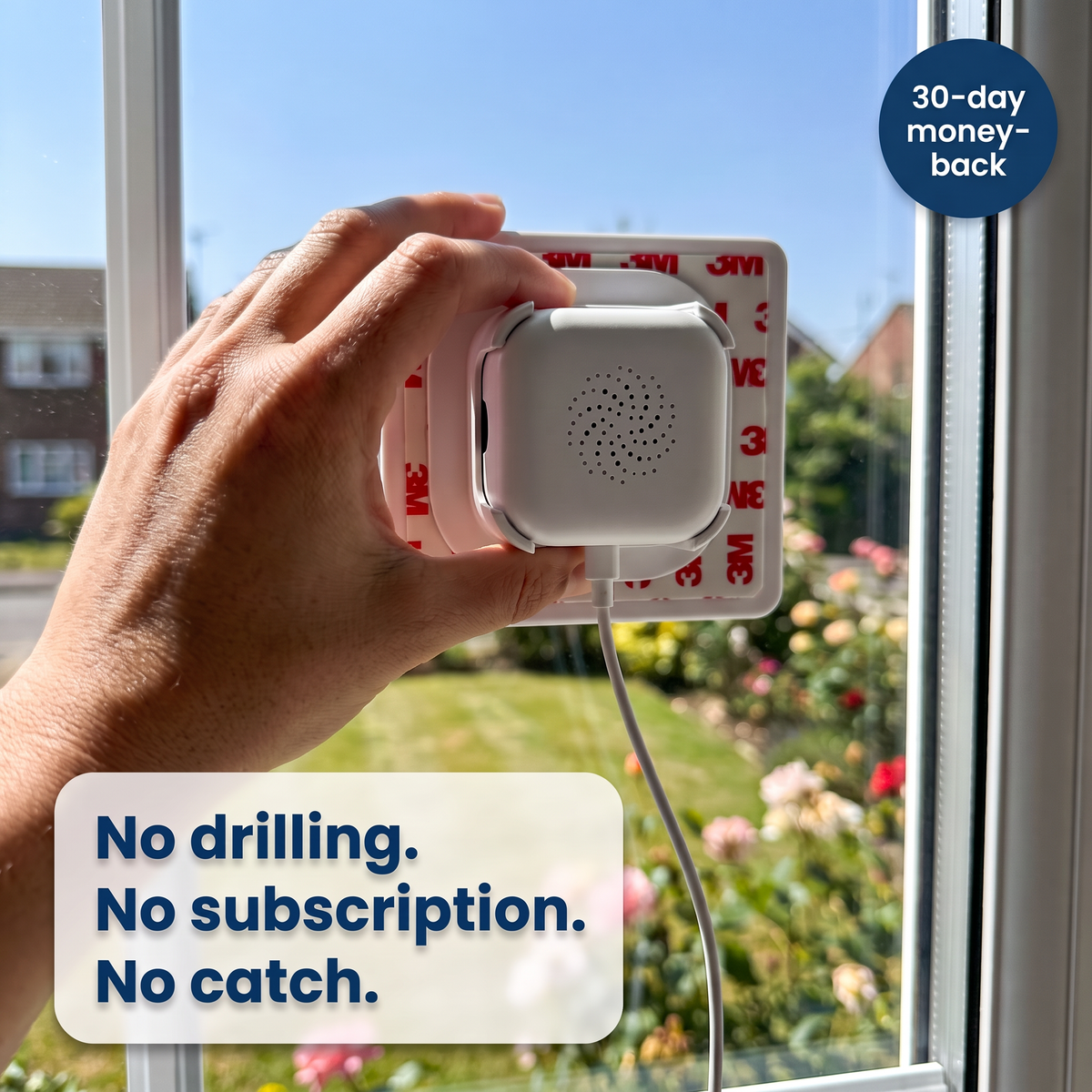 Hand sticking the LookOut camera to the inside of a window: no drilling, no subscription, 30-day money-back