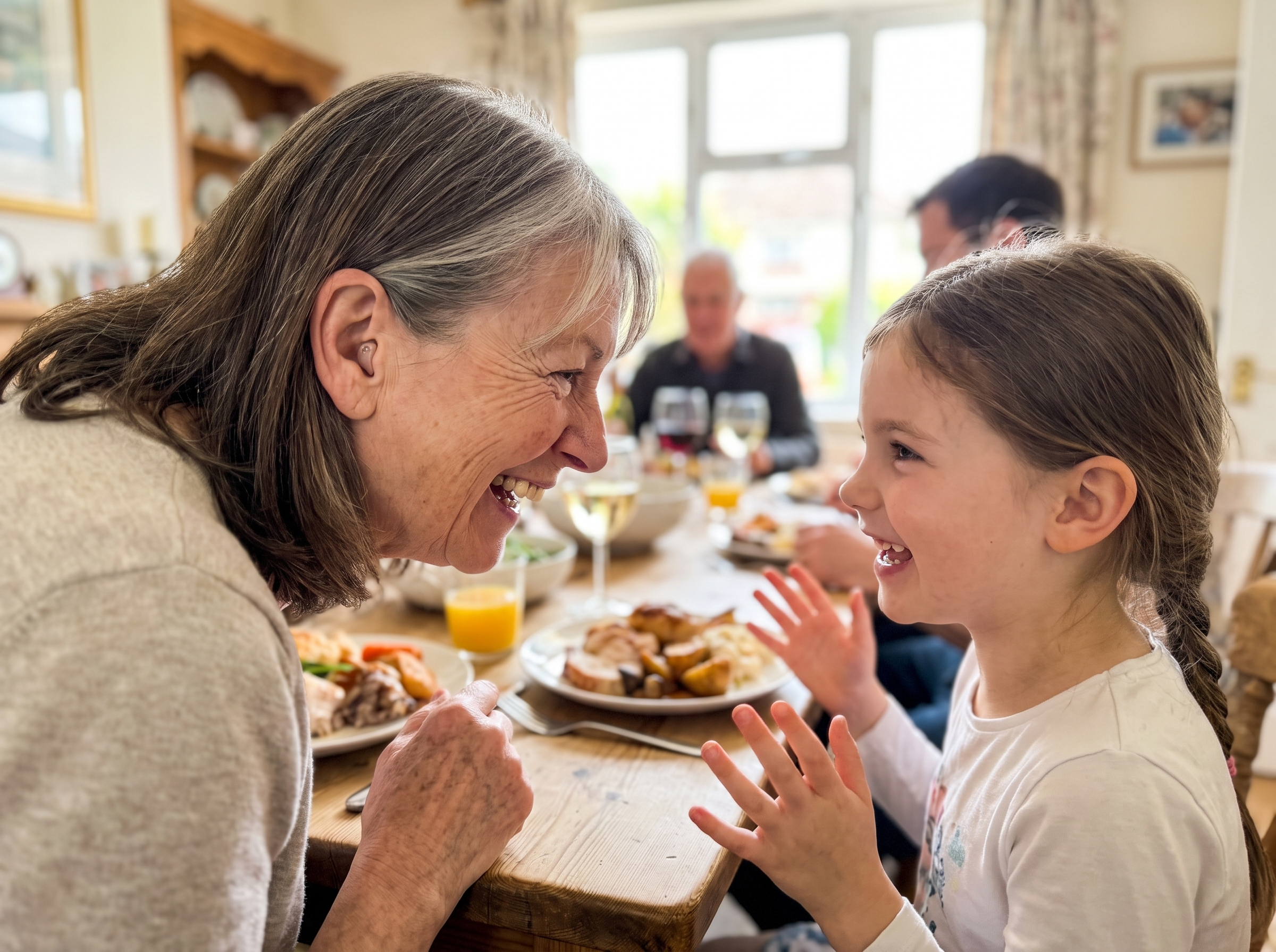 Grandmother back at the family table, listening to her granddaughter's story